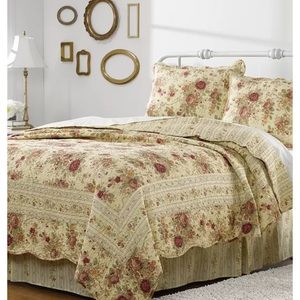 Brand new quilt and two pillow cases.